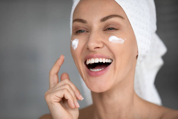 istock Happy lady grooming herself in bathroom, skincare routine. 1217416440