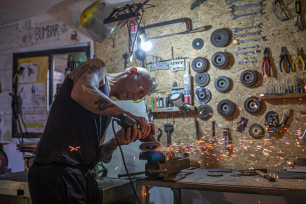 Craftsman working with a electric grinder in his workshop