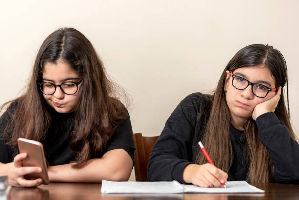 istock two friends are studying at home 1217417201
