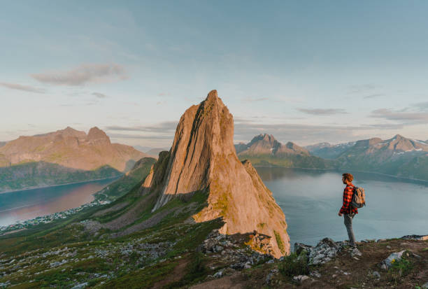 istock Man walking near  mountain on Senja island 1217418584