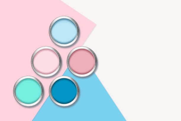 Cans of paint on a colored background.