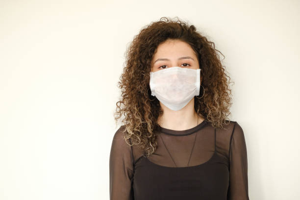 istock young woman with protection mask 1217418671