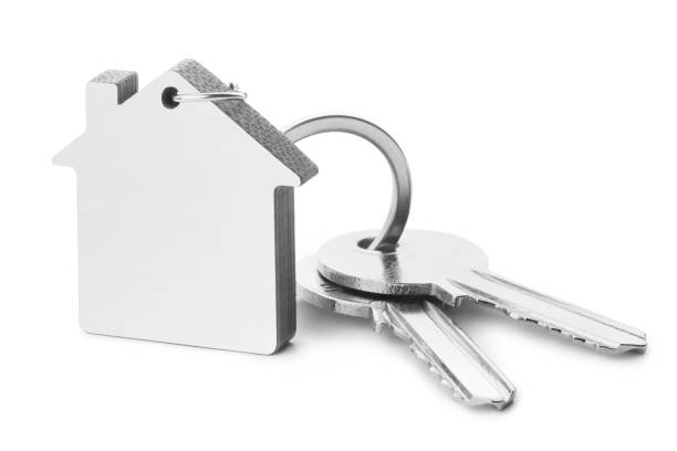 Blank house shaped keychain with two keys on white