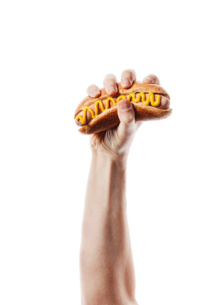 classic american hot dog in hand stock photo