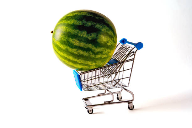 Front view green Watermelon on shopping trolley isolated on white background.Copy space for text.
