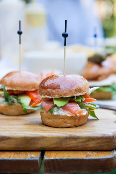 istock Burger with cream cheese, salted salmon, cale, avocado on wheat bun. 1217421355