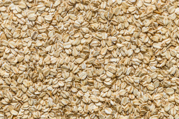 fondo de escamas de avena - oat wheat oatmeal cereal plant fotografías e imágenes de stock