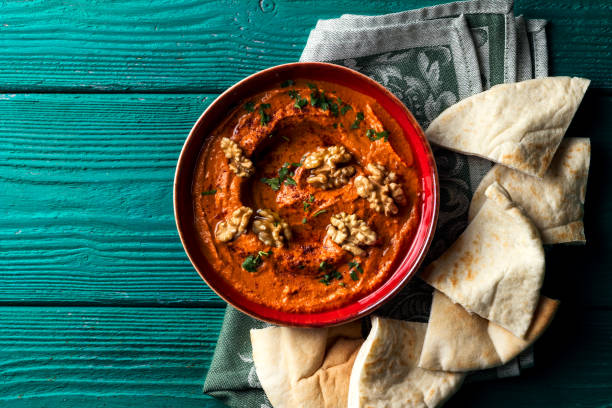 istock Roasted red bell pepper spread - muhammara - in a red bowl 1217422011