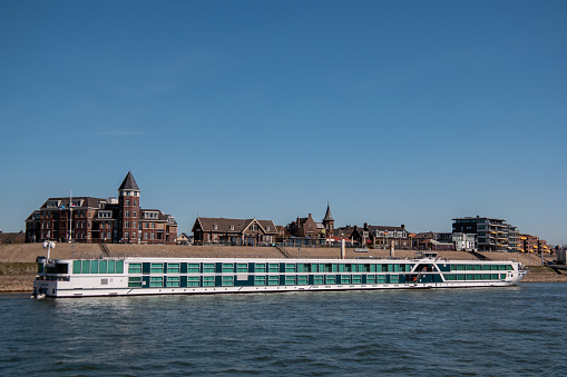 Lobith Netherlands April 2020, passenger boats moored with no work during the Corona , Covid 19 crisis in the Netherlands, passenger ship rhein river Netherlands