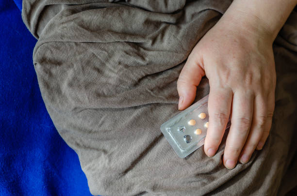 istock Blister with pills in a female hand. 1217426196