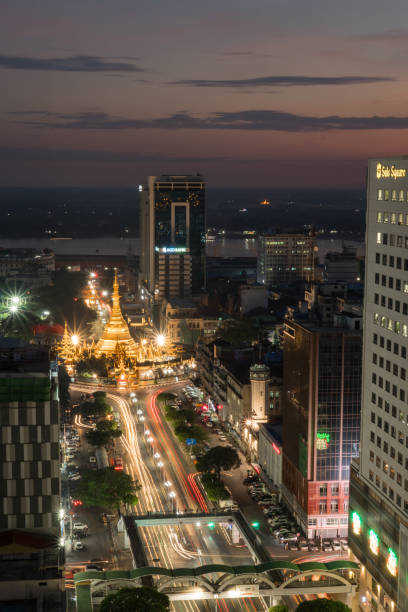 istock YANGON, MYANMAR - DECEMBER 16, 2018: Traffic around the Sule Pagoda at dusk. 1217428065