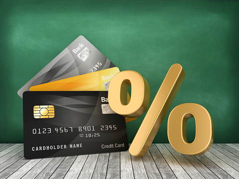 Credit Cards with Percentage Symbol on Chalkboard - 3D Rendering