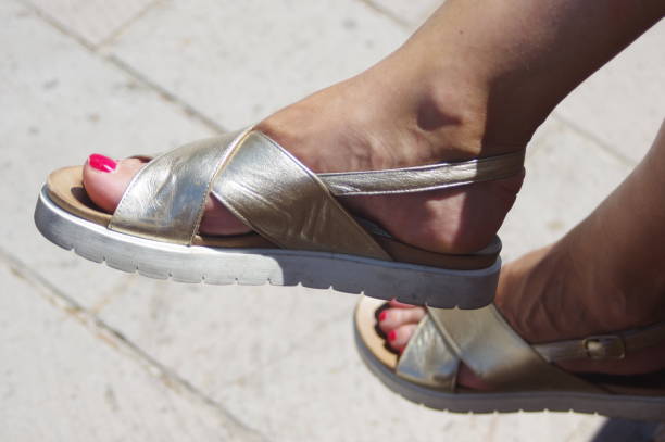 istock Women's feet and beautiful shoes. 1217432173