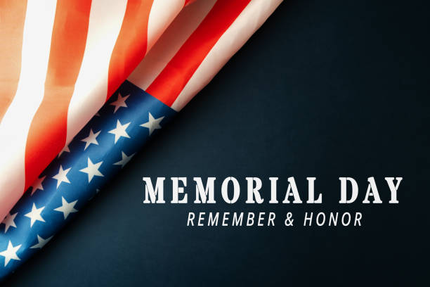 istock Memorial Day with American flag on blue background 1217432294