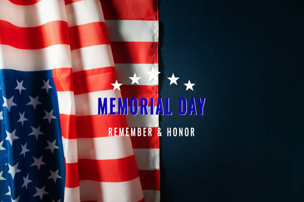 istock Memorial Day with American flag on blue background 1217432345