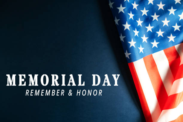 istock Memorial Day with American flag on blue background 1217432393