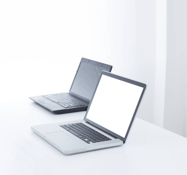 istock Laptop computer on desk with isolated screen for mockup. 1217435433