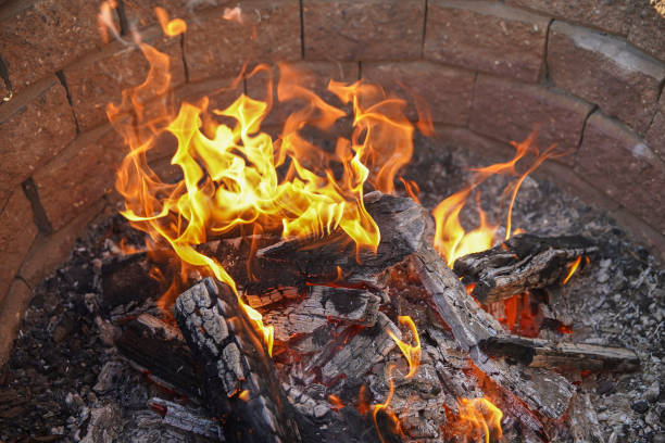 istock Small campfire with flames, smoldering wood. 1217435605
