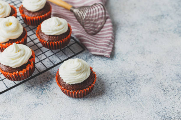 istock Chocolate cupcakes with cap of cheese cream 1217435675