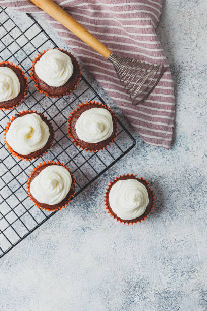 istock Chocolate cupcakes with cap of cheese cream 1217435698