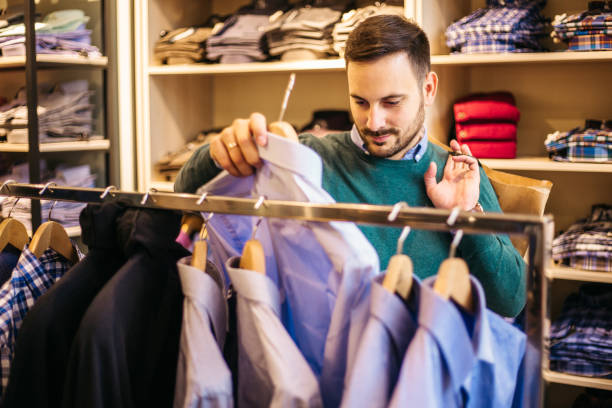 istock Handsome young male looking to buy jacket 1217438637