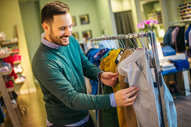 istock Handsome young male looking to buy pants 1217438802