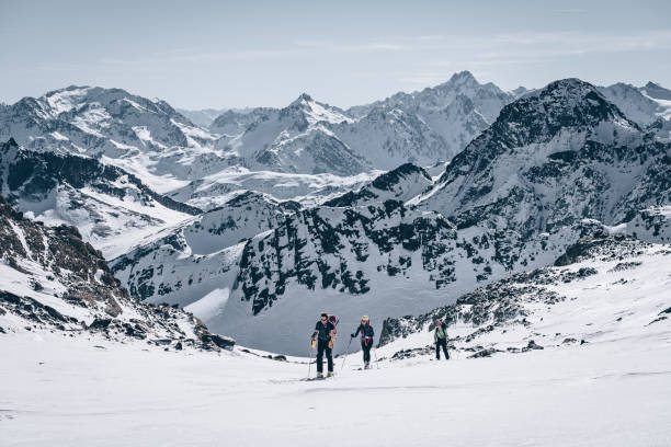 istock Backcountry skiers ascend mountain 1217439964