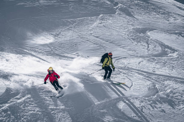 istock Backcountry skiers descend mountain 1217440103
