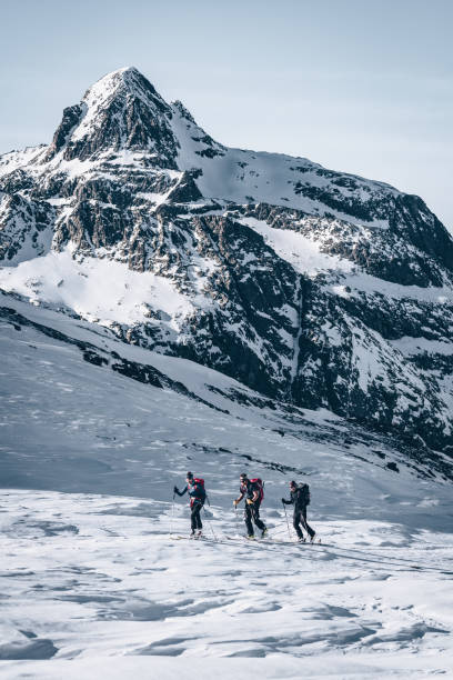 istock Backcountry skiers ascend mountain 1217440176
