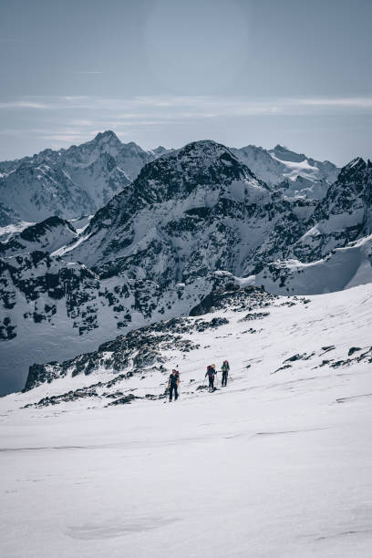 istock Backcountry skiers ascend mountain 1217440280