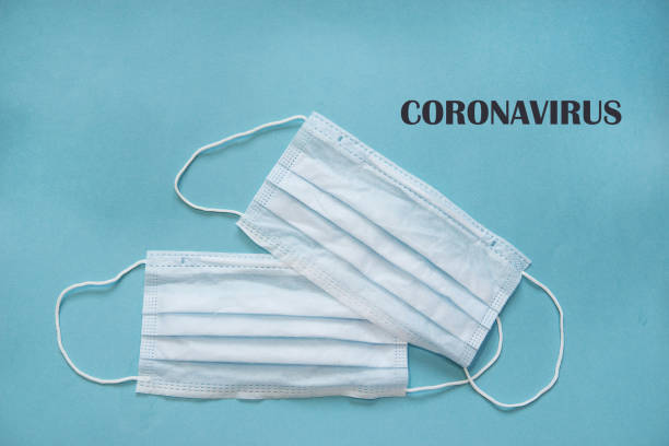 istock Text phrase Coronavirus on a blue background with protective masks. Novel coronavirus 2019-nCoV, MERS-Cov middle East respiratory syndrome coronavirus. 1217443135