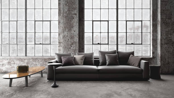 istock Modern and comfortable sofa in old rustic factory interior 1217444717