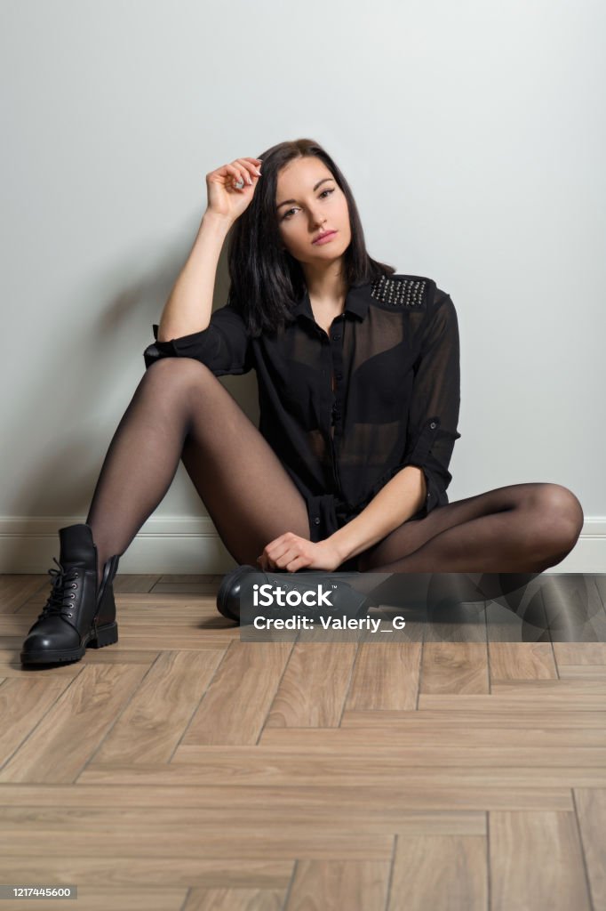 Fashionable In Black Tights On Legs And Stylish Leather Boots Stock Photo - Download Image Now - iStock