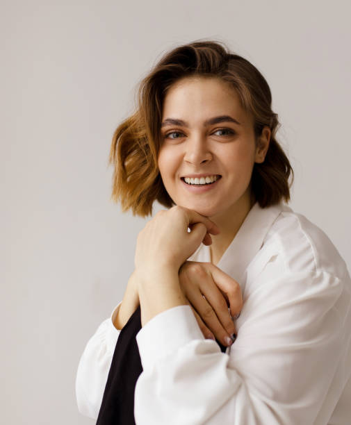 istock Happy beautiful woman smiling at camera 1217445869