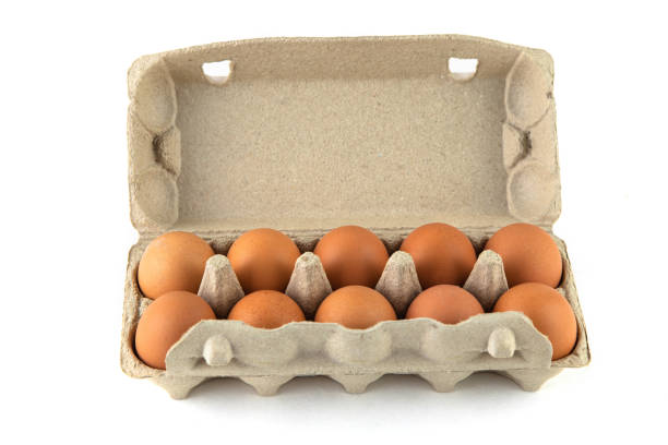 istock One dozen chicken eggs in a cardboard container on a white background 1217446195