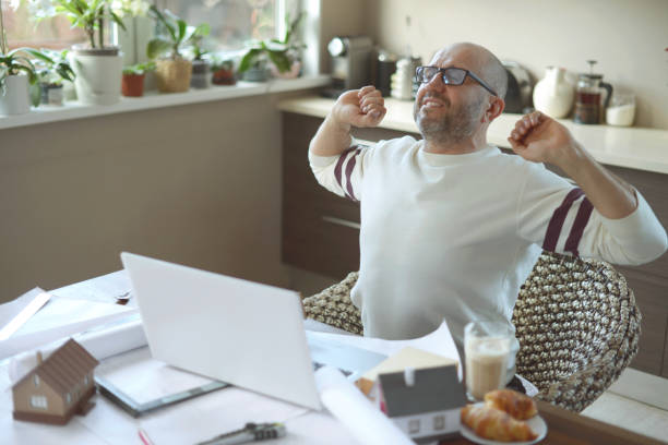 istock Mature adult man working at home 1217447530
