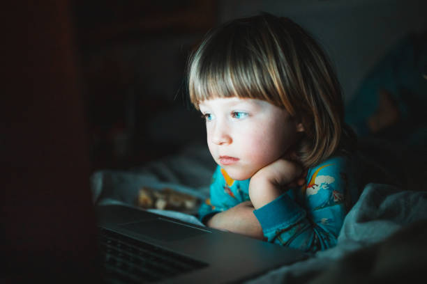 istock Toddler boy watching cartoons at home 1217450314