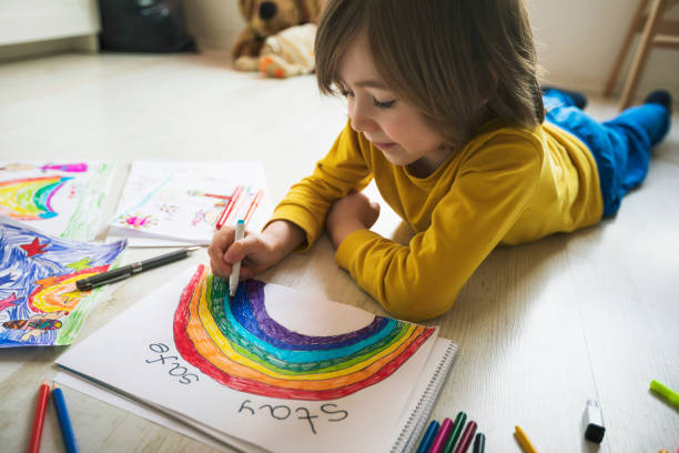 istock Happy boy drawing at home. Covid-19 crisis 1217450645
