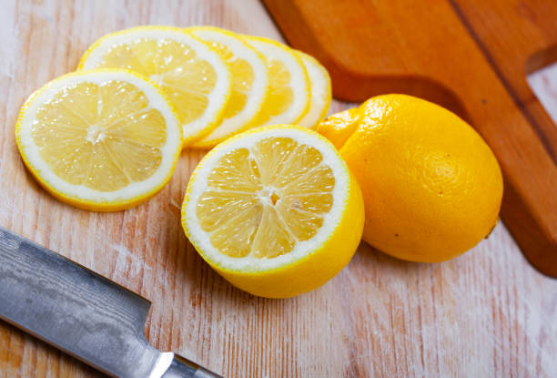 istock Sliced lemons on wooden table 1217450648