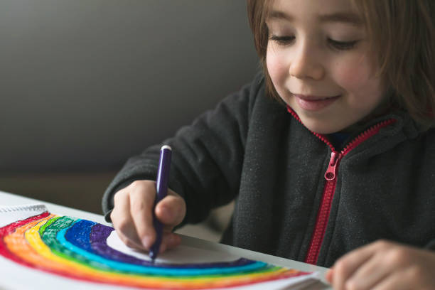 istock Happy boy drawing at home. Covid-19 crisis 1217450685