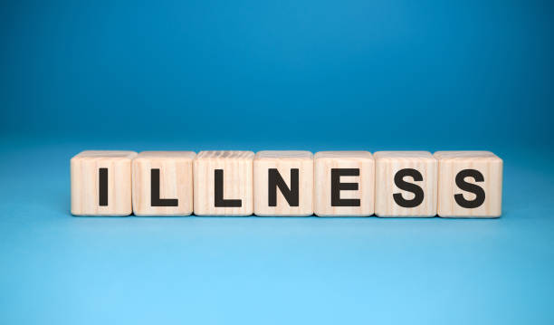 istock ILLNESS word cube on a blue background. Medical concept. 1217450728