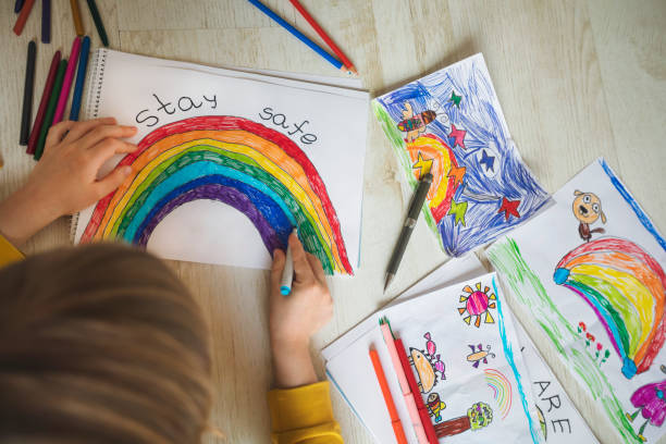 istock Happy child drawing at home. Covid-19 crisis 1217450797