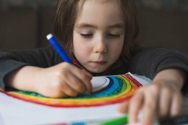 istock Happy boy drawing at home. Covid-19 crisis 1217450835