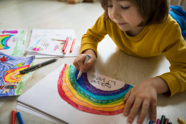 istock Happy boy drawing at home. Covid-19 crisis 1217450915