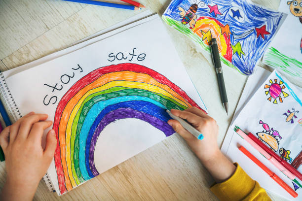 istock Happy child drawing at home. Covid-19 crisis 1217450927