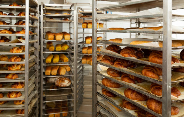 Trolley with baked bread in bakery