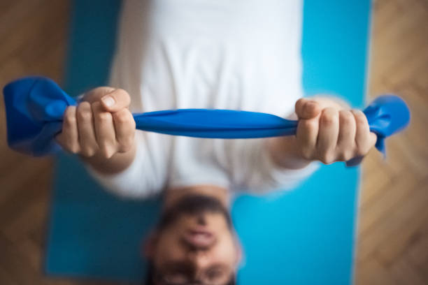 istock Exercises at home with rubber band 1217451988