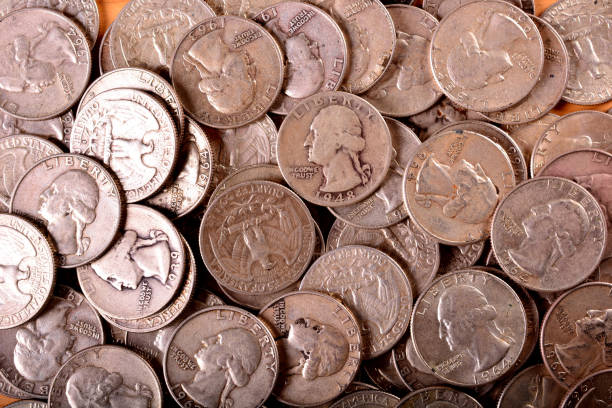 istock Ninety Percent Silver Quarter Background 1217453165