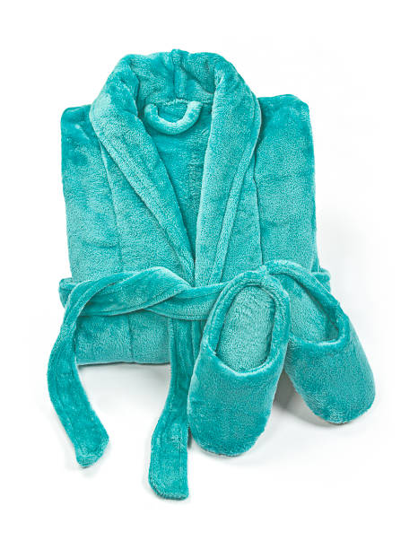 istock Folded bathrobe, and slippers isolated on white, top view. 1217453400