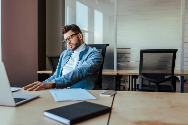 istock Selective focus of thoughtful IT worker at table in coworking space 1217453639